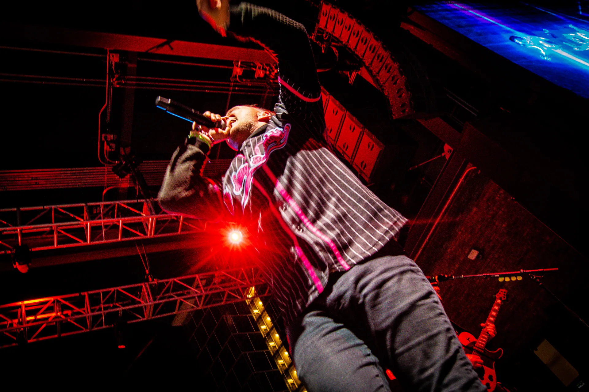 So Long Goodnight’s vocalist leaning into the microphone